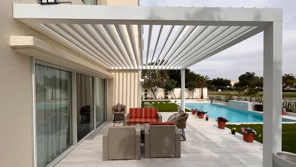 Bioclimatic pergola with open louvres over a terrace