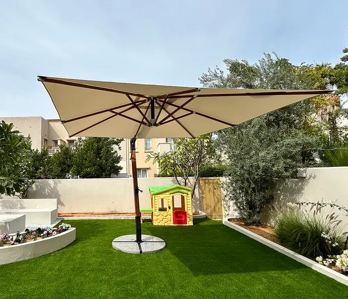 Lumley side post hanging umbrella over an outdoor seating area