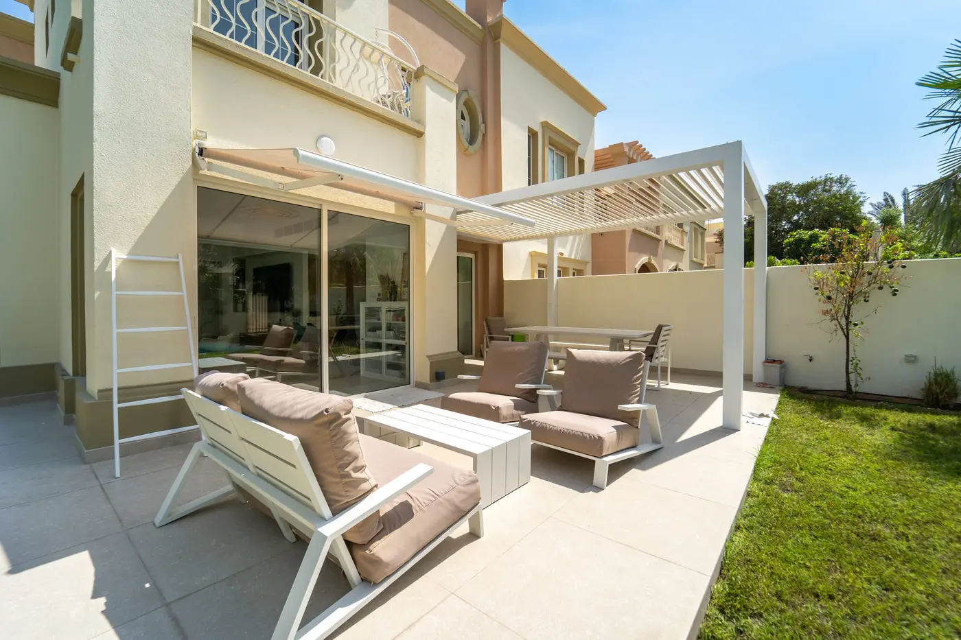 White Liwa fixed louvre pergola over a lounge terrace at a villa in The Springs, Dubai
