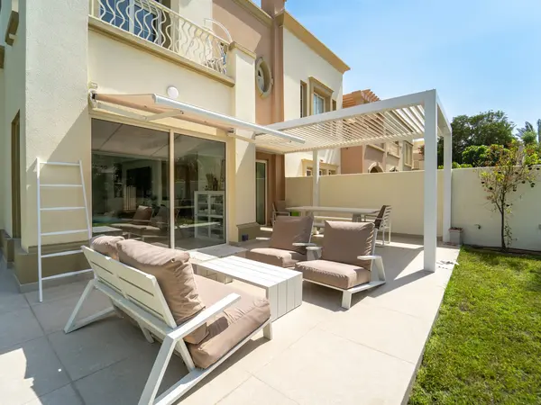 White Liwa fixed louvre pergola over a lounge terrace at a villa in The Springs, Dubai